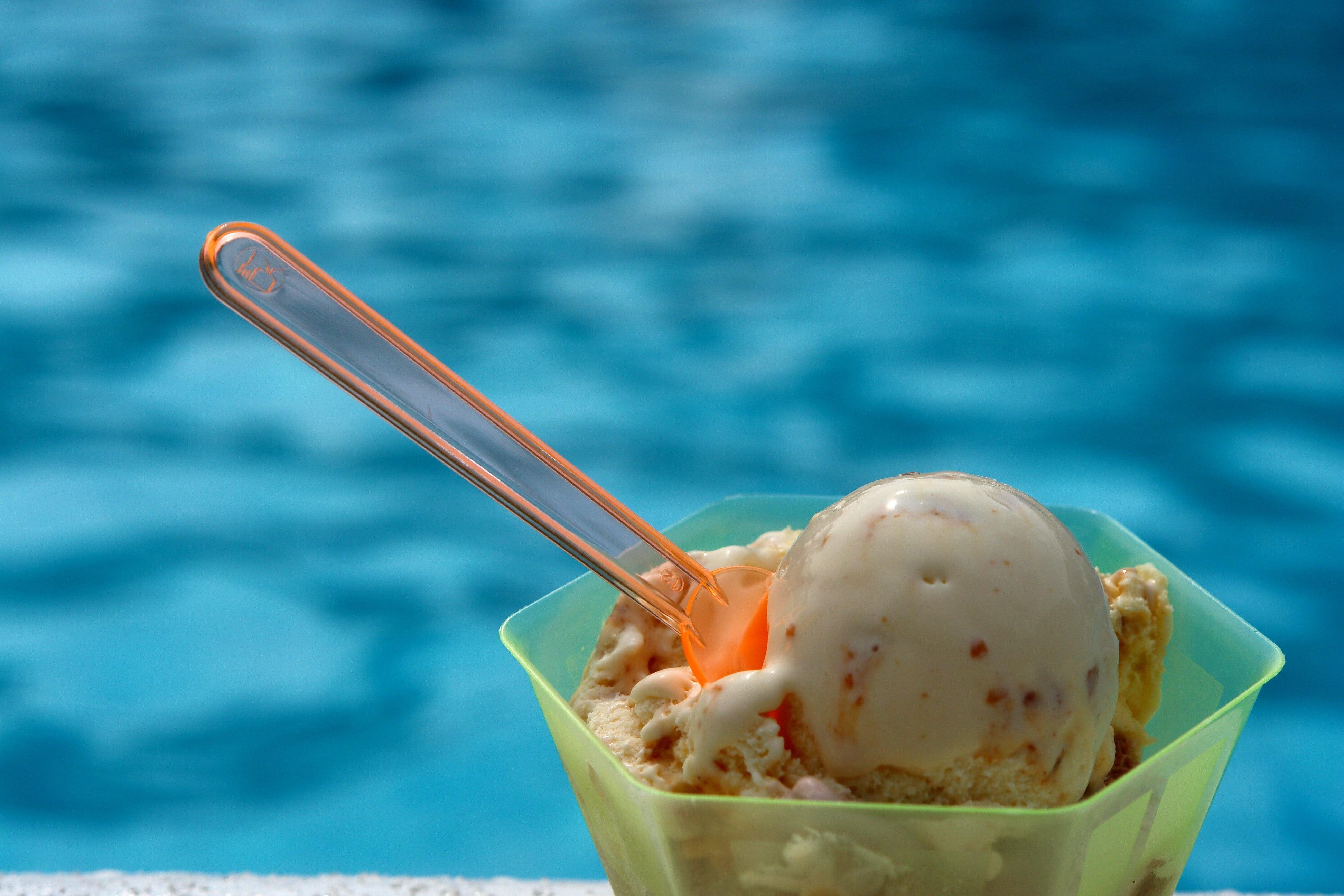 Ice cream sitting on a pool deck Ice cream sitting on a pool deck