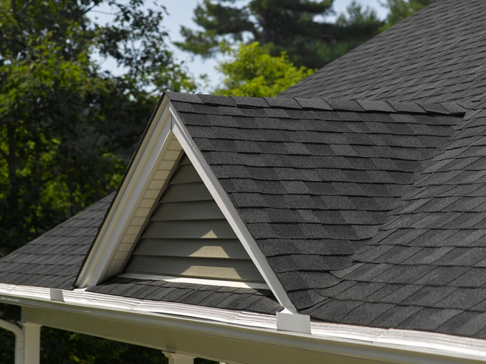 A close-up of asphalt shingles that will boost a home’s curb appeal.