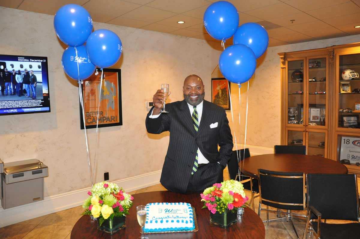 Window World franchisee Greg Deathridge toasts a new store from the corporate office