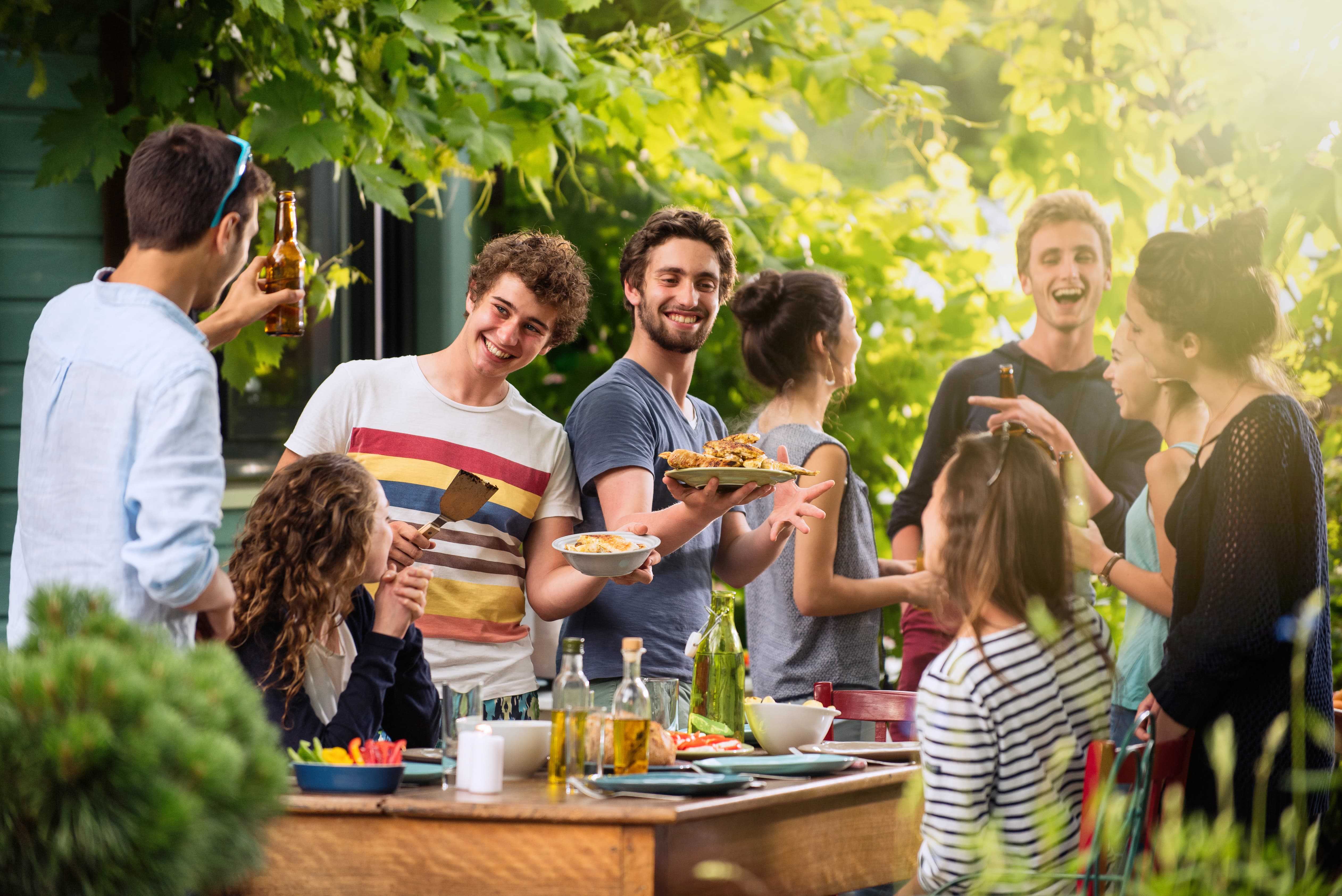 Group enjoying a party in their backyard