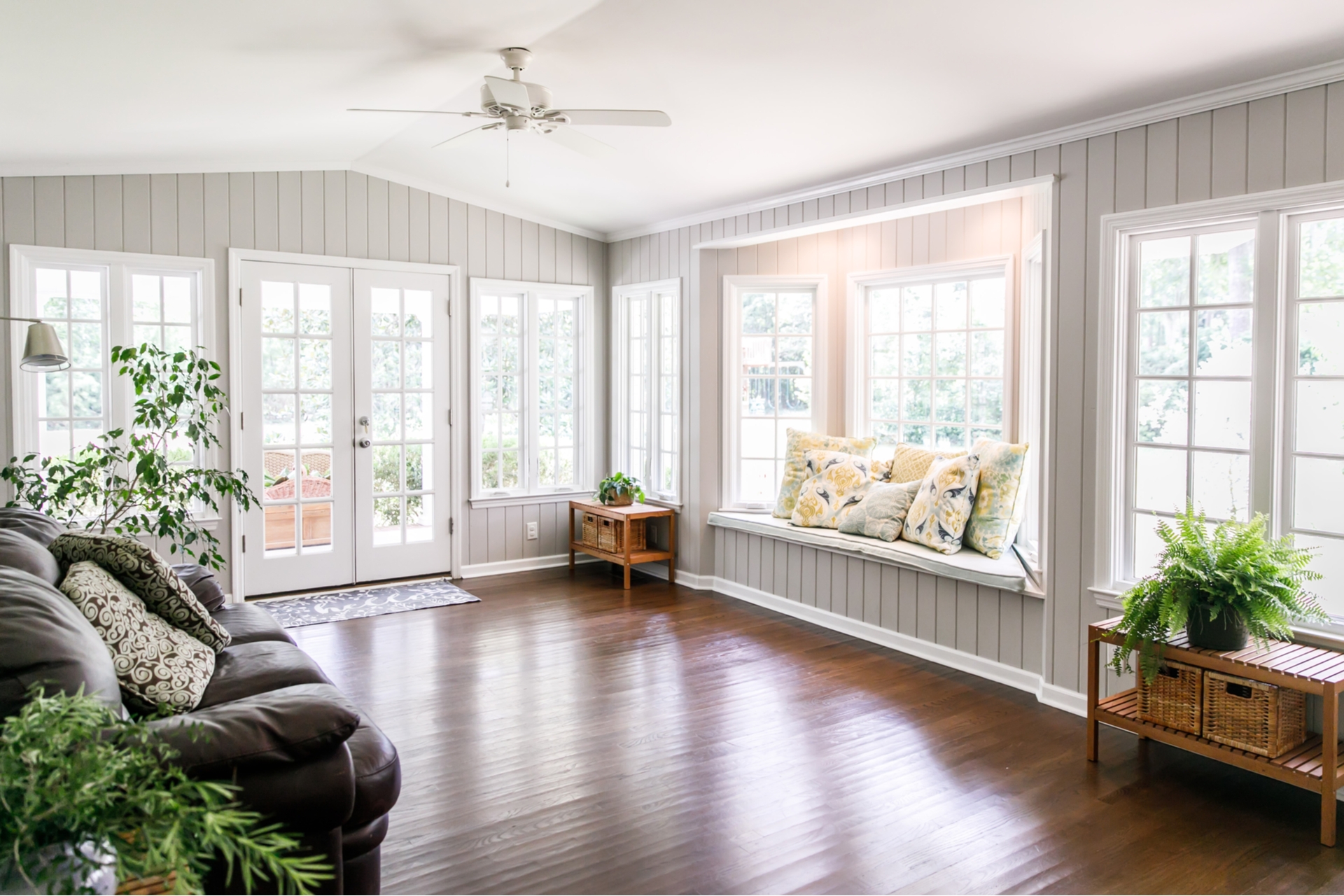 Living Room Connected To Solarium Brick Wall