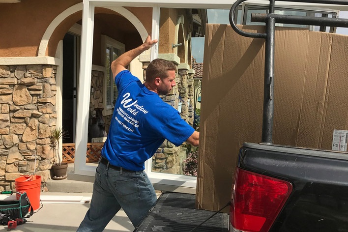 Window World installer removing products from truck Window World installer removing products from truck