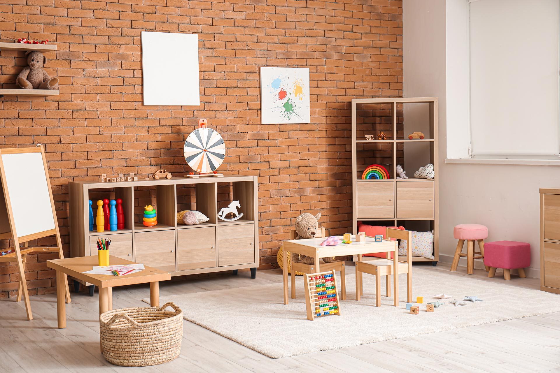 A kid’s playroom with toys and natural wood furniture