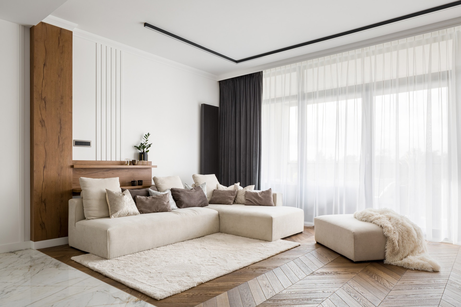 A neutral colored living room with patio doors