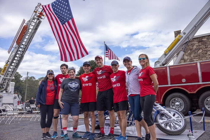 Folks from Team Red, White & Blue standing outside Window World, Inc. during Window World Old Glory Day