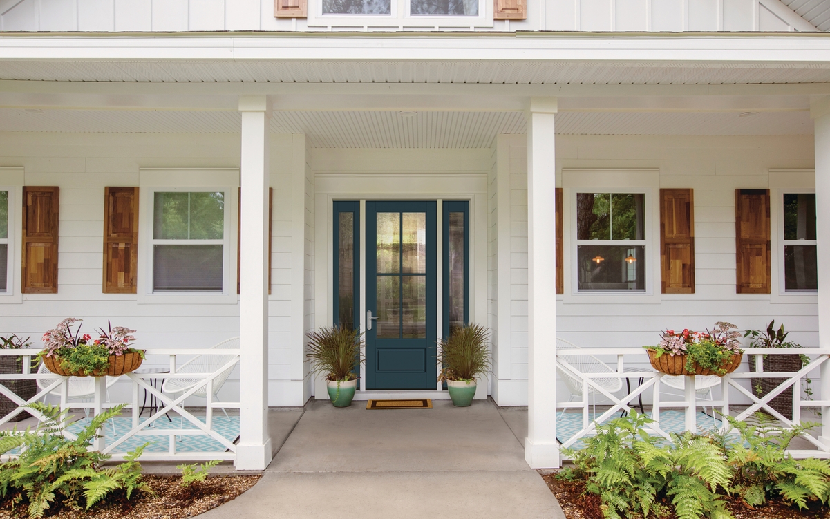 Blur front door on a white coastal home