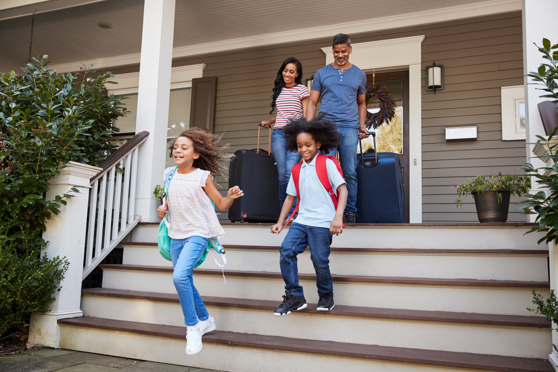 A family leaving their house for vacation