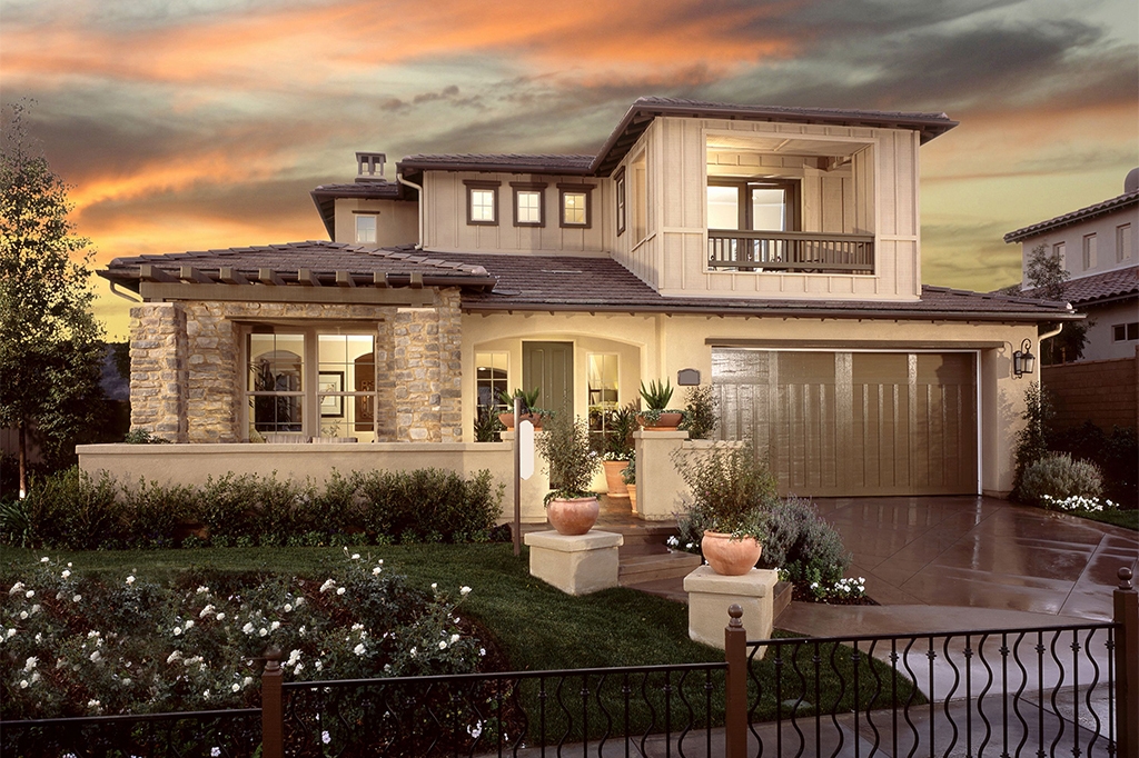 Southwestern style house with wrought iron gate and stonework Southwestern style house with wrought iron gate and stonework