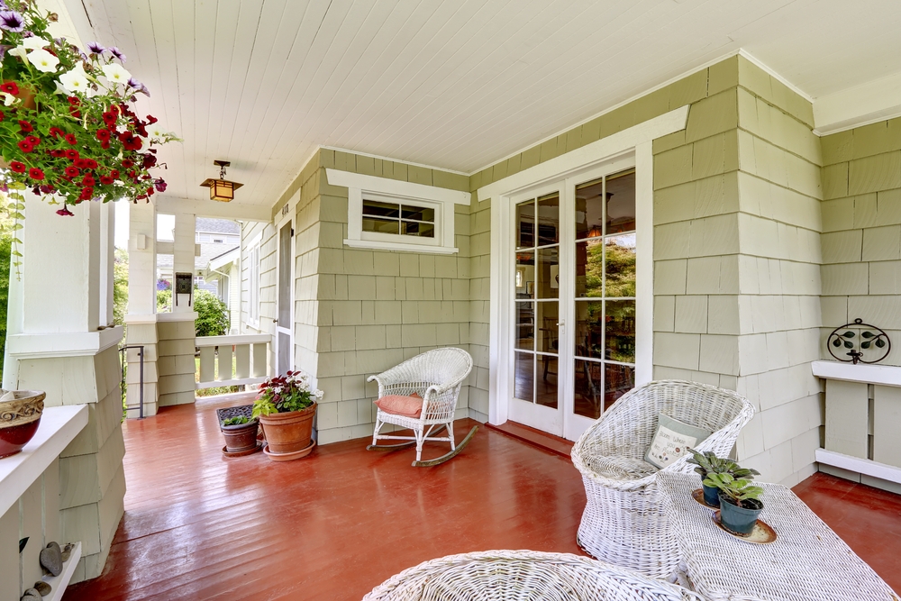 Front porch with furniture and seasonal decor
