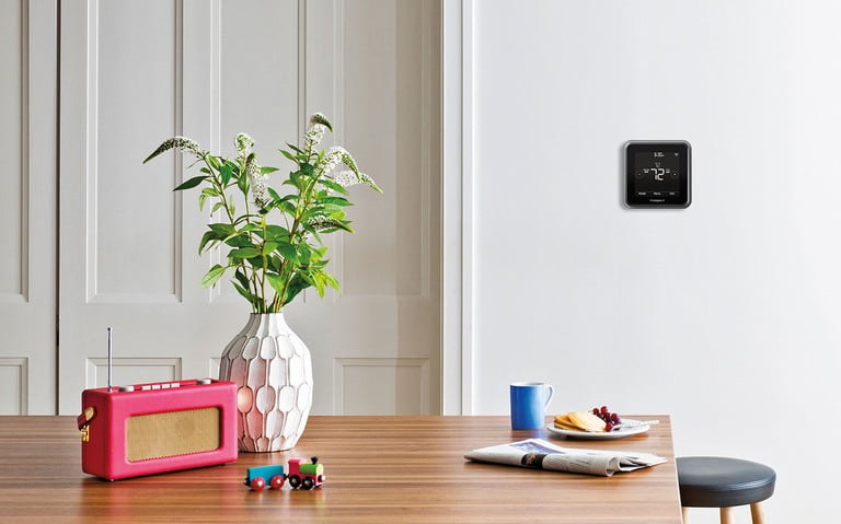 Smart thermostat on wall Smart thermostat on wall