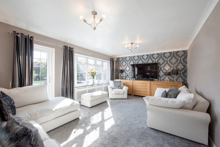 A living room with white furniture