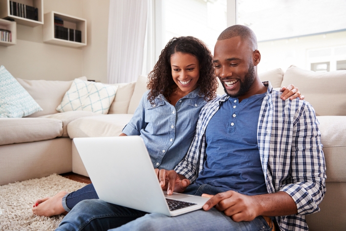 Couple planning a home remodel on a computer together