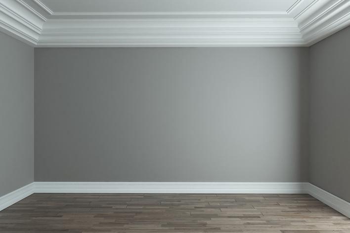 An empty room with grey walls