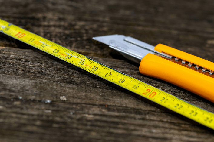 Window screen repair supplies — a measuring tape and utility blade