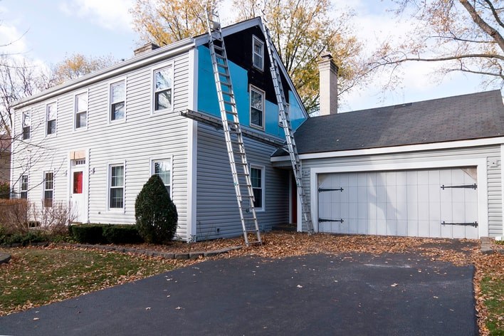 New vinyl siding installation on a family home