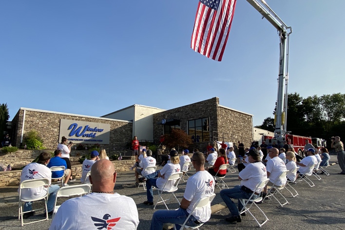 Employees gather at the corporate office on 9/11