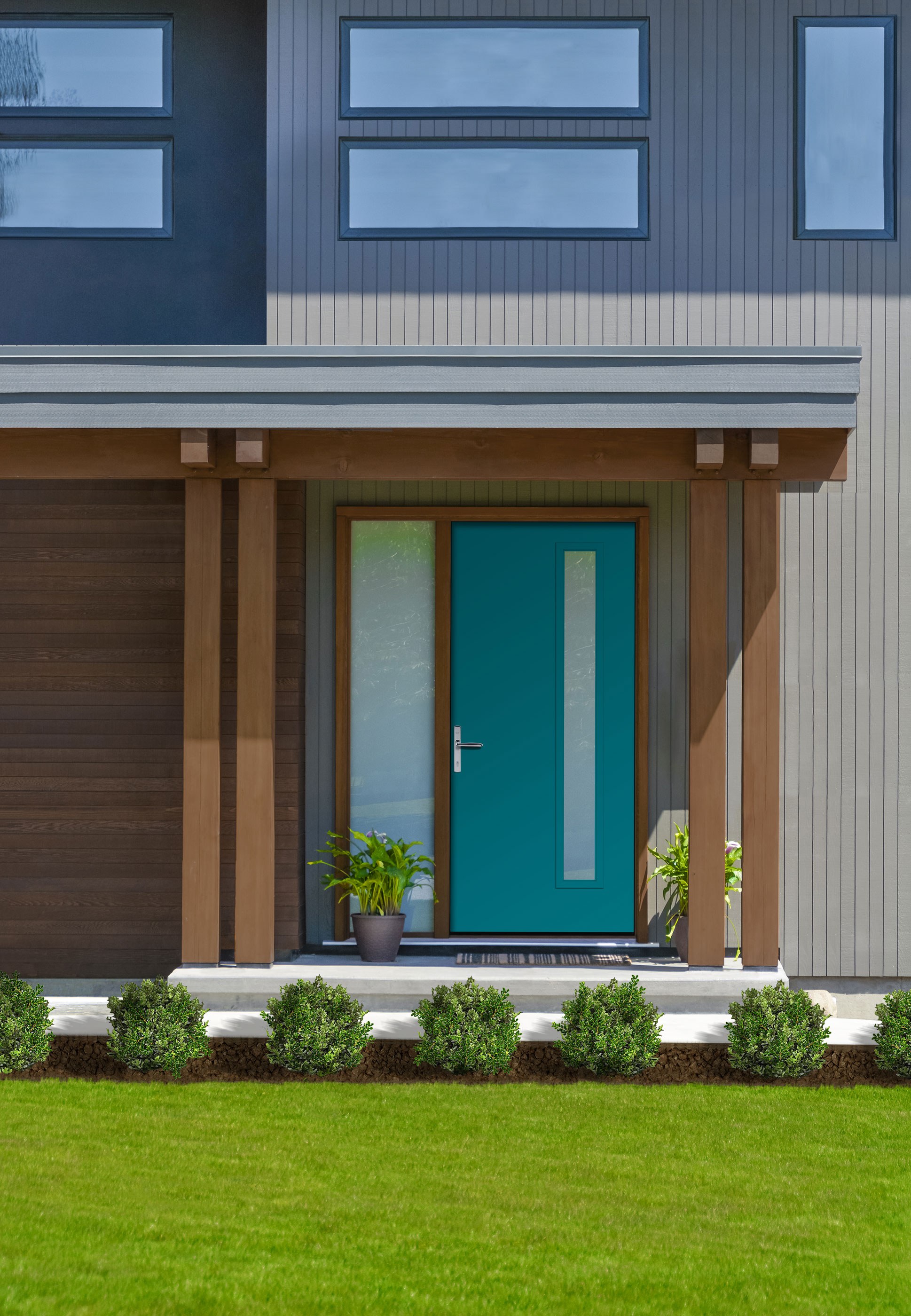 A stylish and sleek blue modern entry door on a brown-and-gray home.