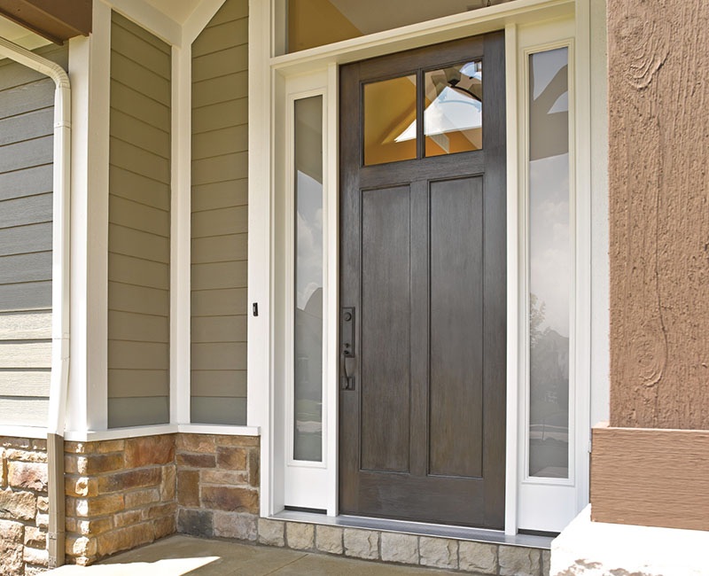 A classic, woodgrain entry door on a modern home.